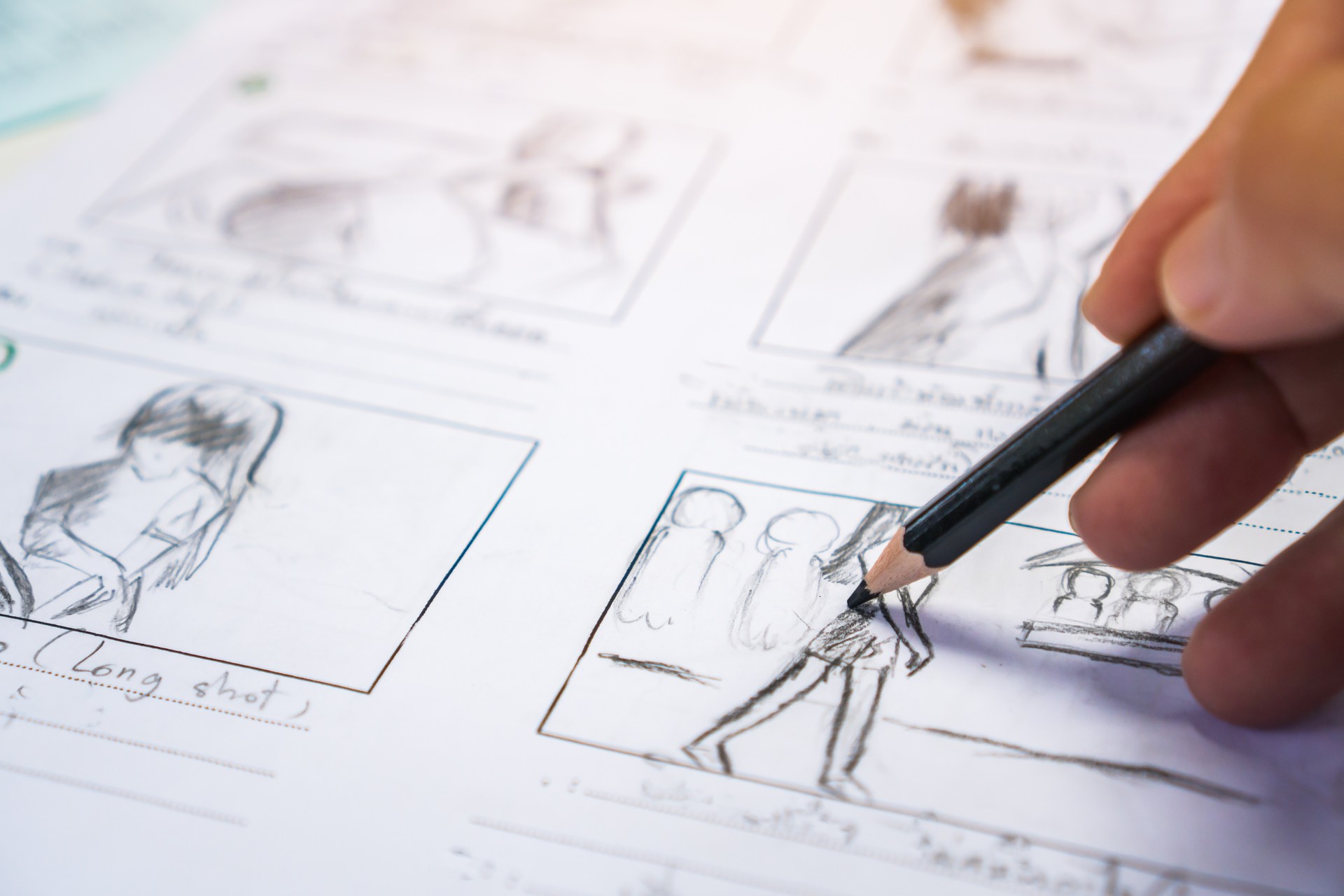 Hands on Storyboard movie layout for pre-production, storytelling drawing creative for process production media films. Script video editors and writing graphic in form displayed in maker shooting